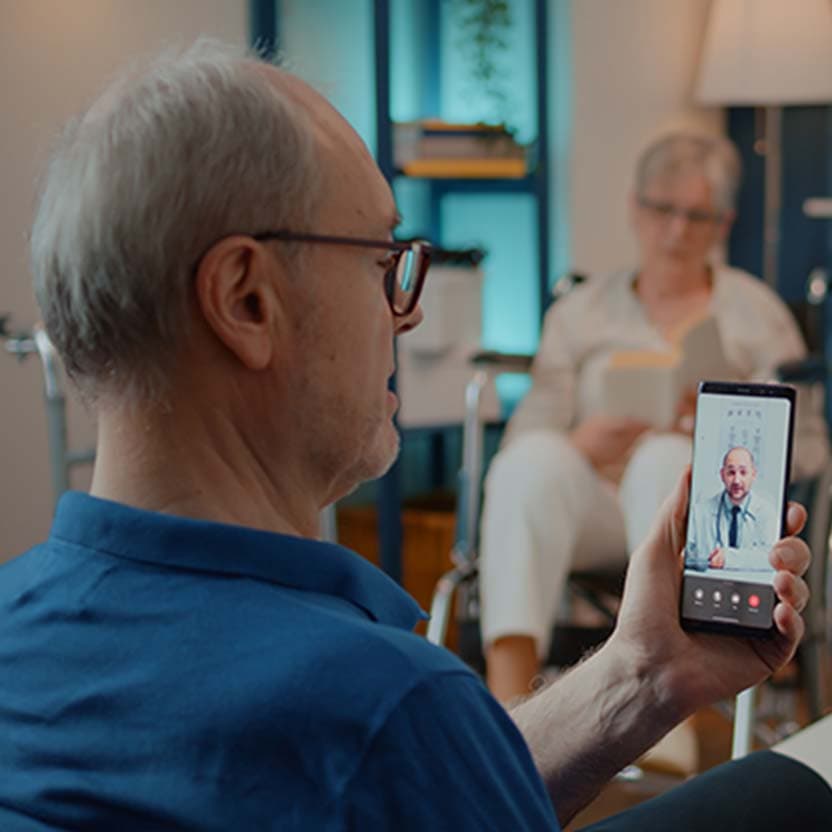 Elderly man being educated by a doctor online