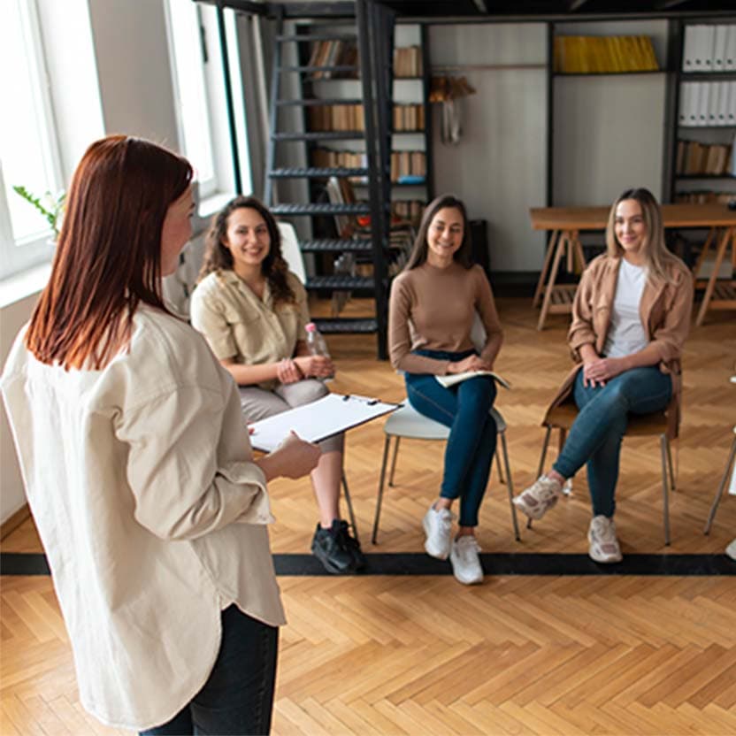 group of people being addressed by their therapiests